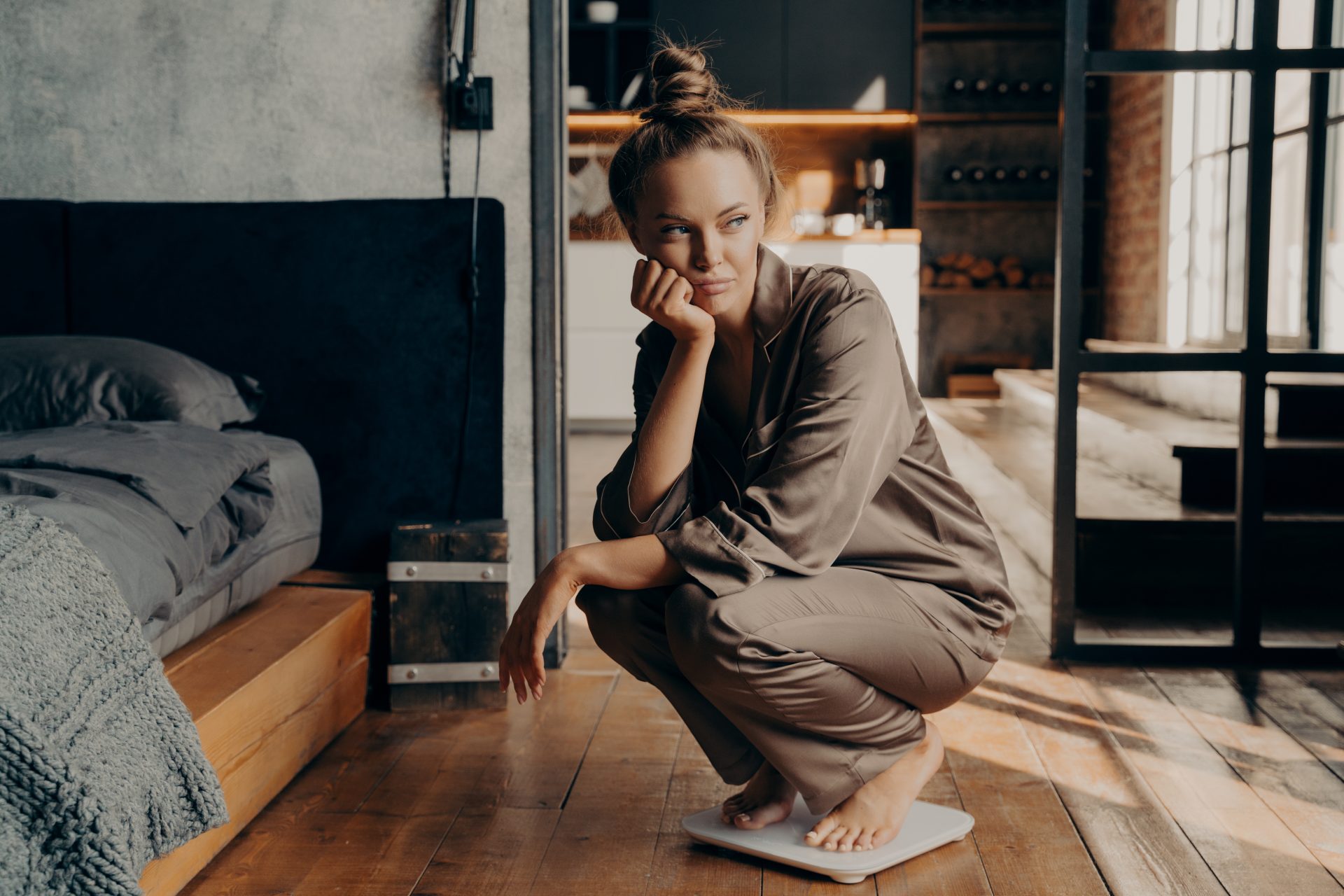 young-dissatisfied-unhappy-woman-crouched-over-ele-2022-02-22-15-39-38-utc