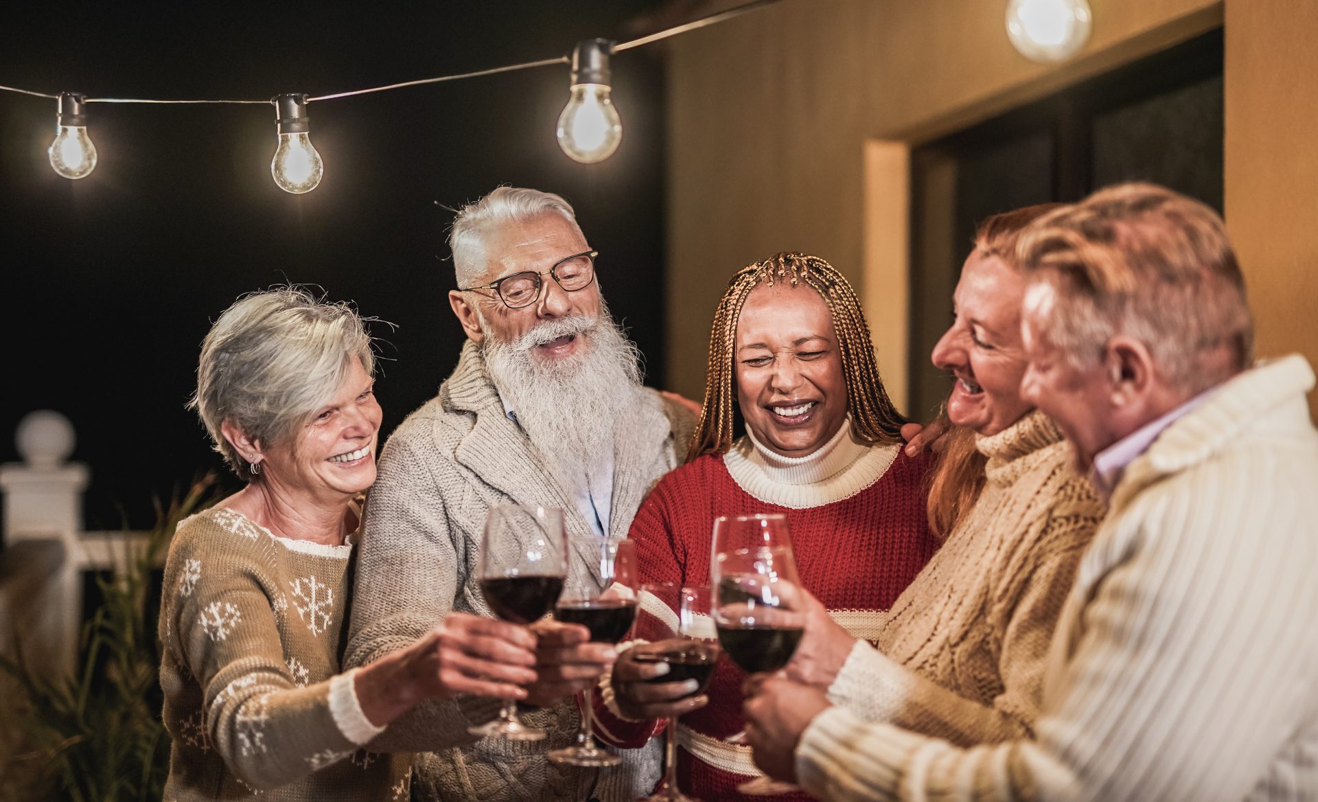happy-senior-people-cheering-with-red-wine-at-chri-2023-11-27-05-14-26-utc