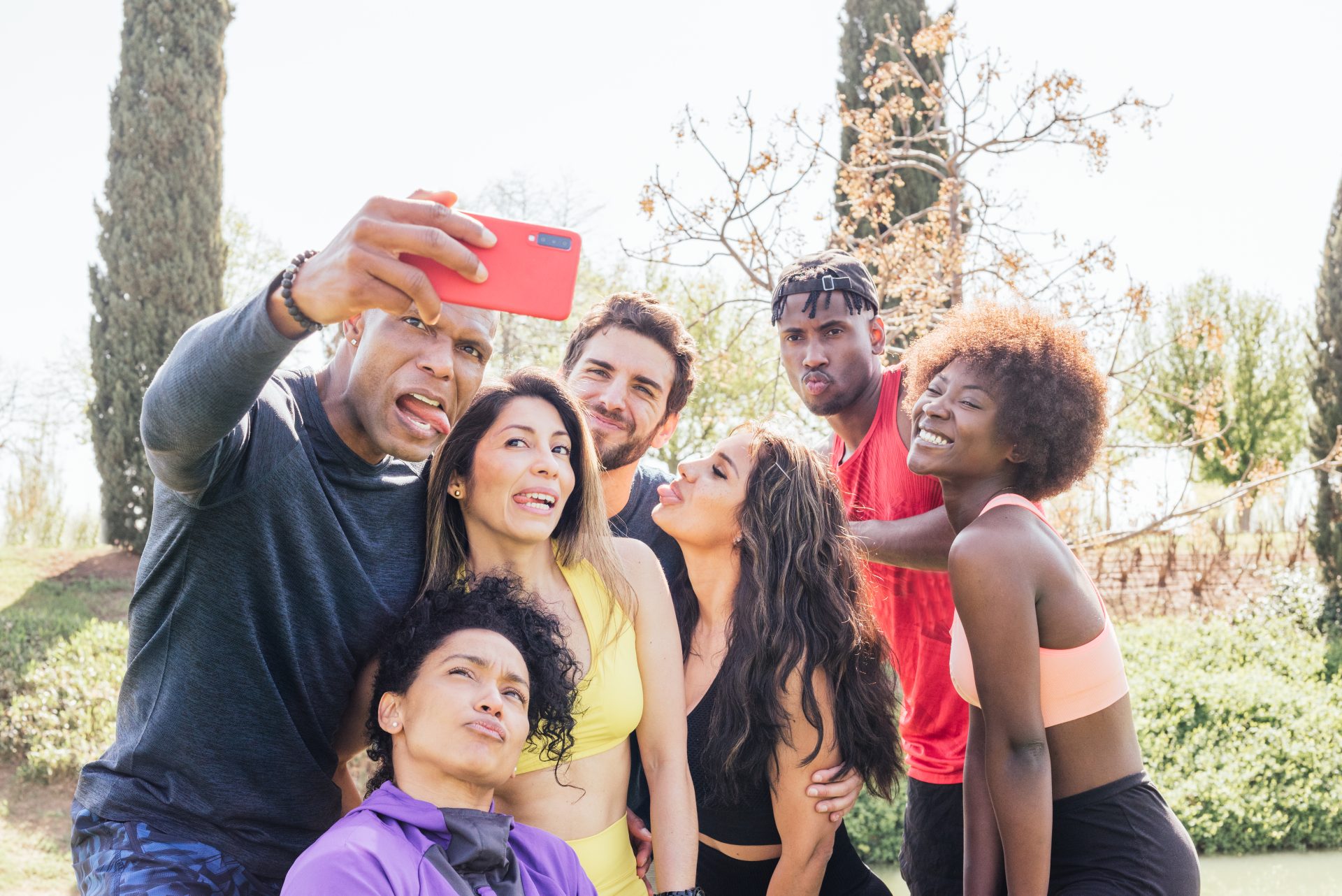 group-of-runners-taking-a-selfie-in-a-park-making-2023-11-27-05-16-06-utc